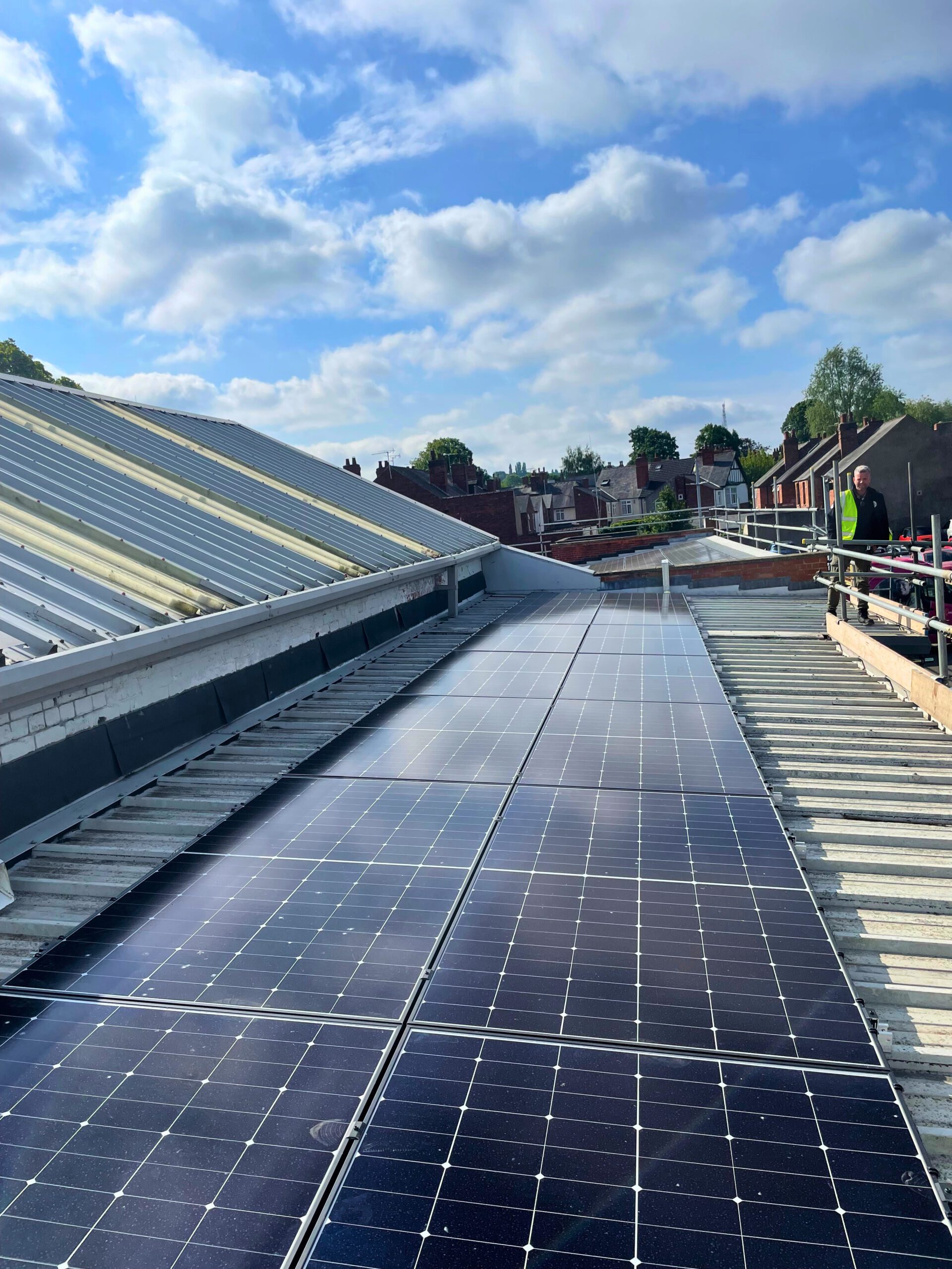 Solar panels being installed on the roof of Jacksons Workwear
