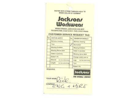 A Jacksons customer service request tag showing a man asking for repair to a tear on his Jacket which would have been attached to the workwear as it was sent in
