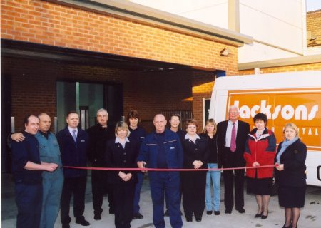 Jacksons management team cutting a ribbon to mark the completion of an extension to our current site in Lincoln